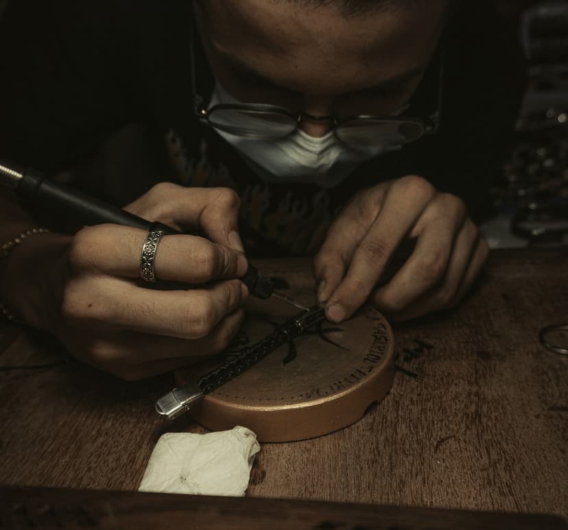 Craftsman working on a leather jacket